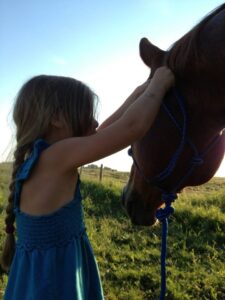 little girl and horse head